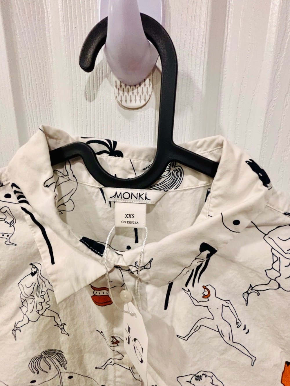 Monki White Button-Up Shirt with Black Line Figures and Orange Accents